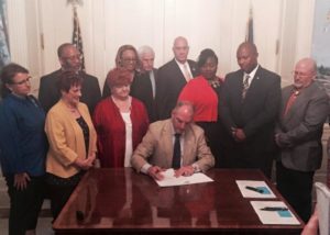(SB477) Gov. John Bel Edwards signs teacher evaluation bill into law.